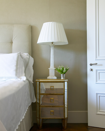 Mirrored nightstand with gold trim
