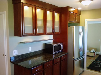Cherry kitchen cabinets with glass doors