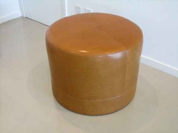 Yellow round storage ottoman