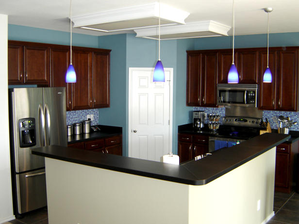 Cherry kitchen cabinets with blue walls